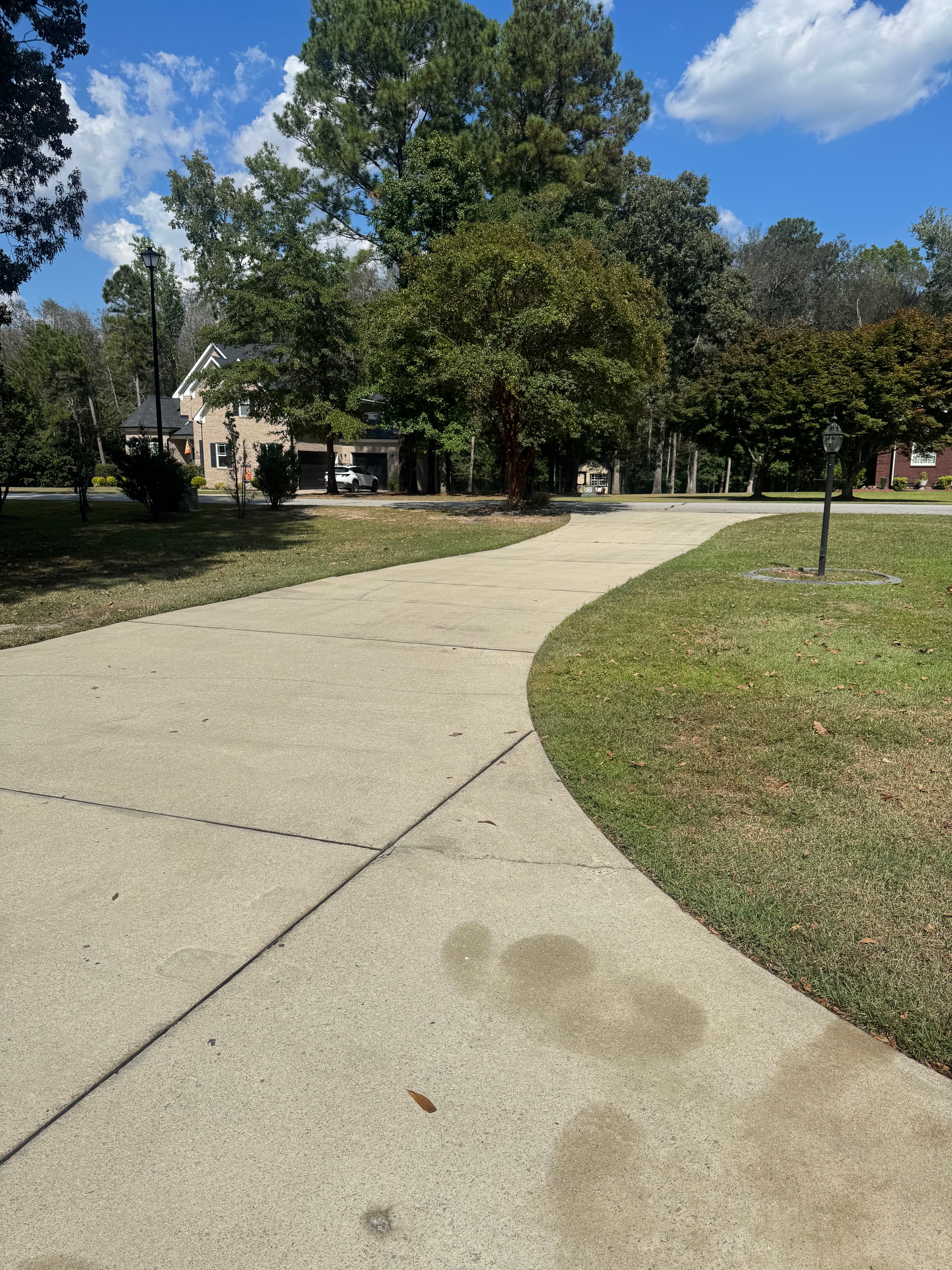 Clean concrete driveway after pressure washing by Max Pressure in Fayetteville NC