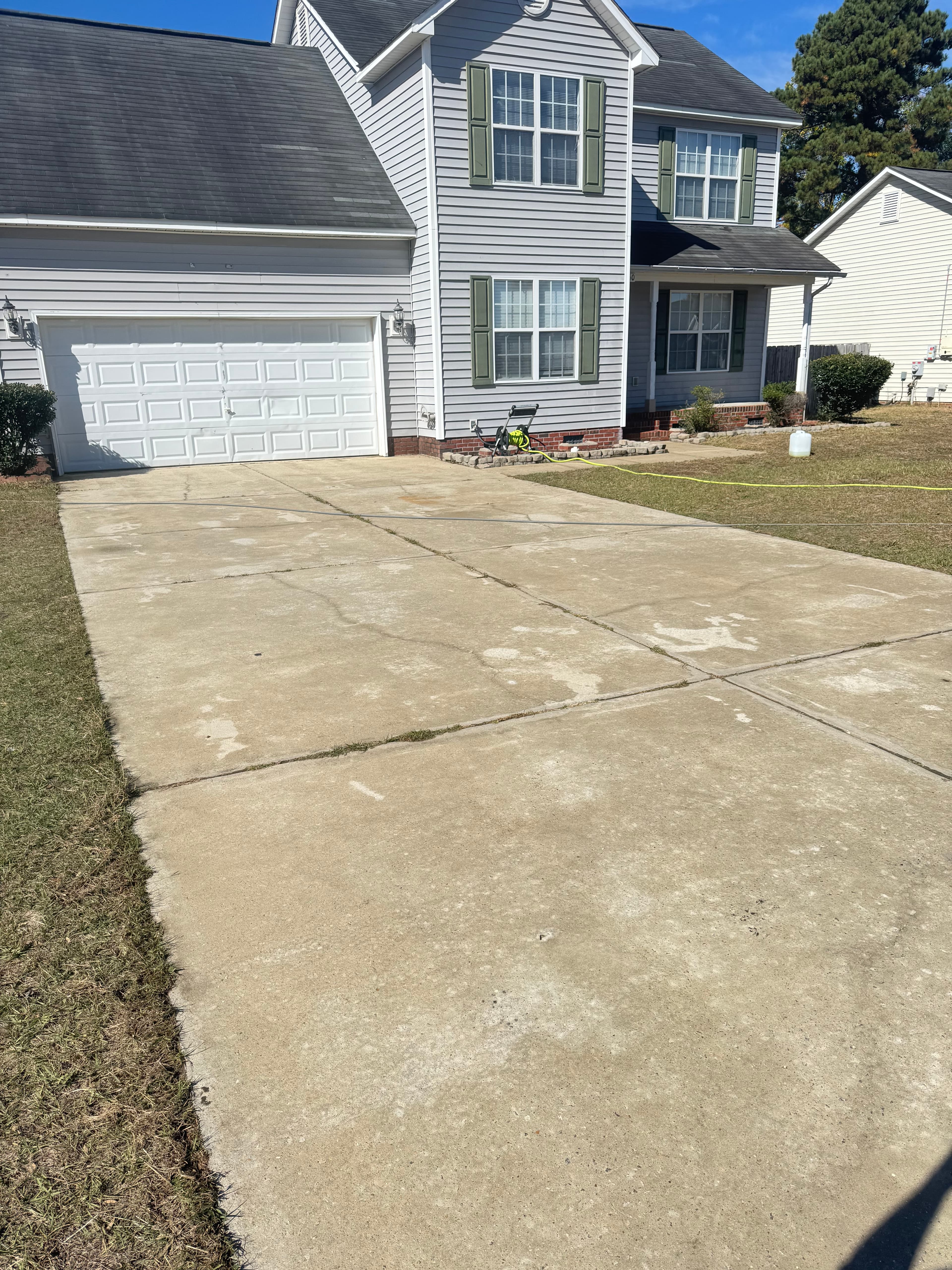 Clean concrete driveway after pressure washing by Max Pressure in Fayetteville NC