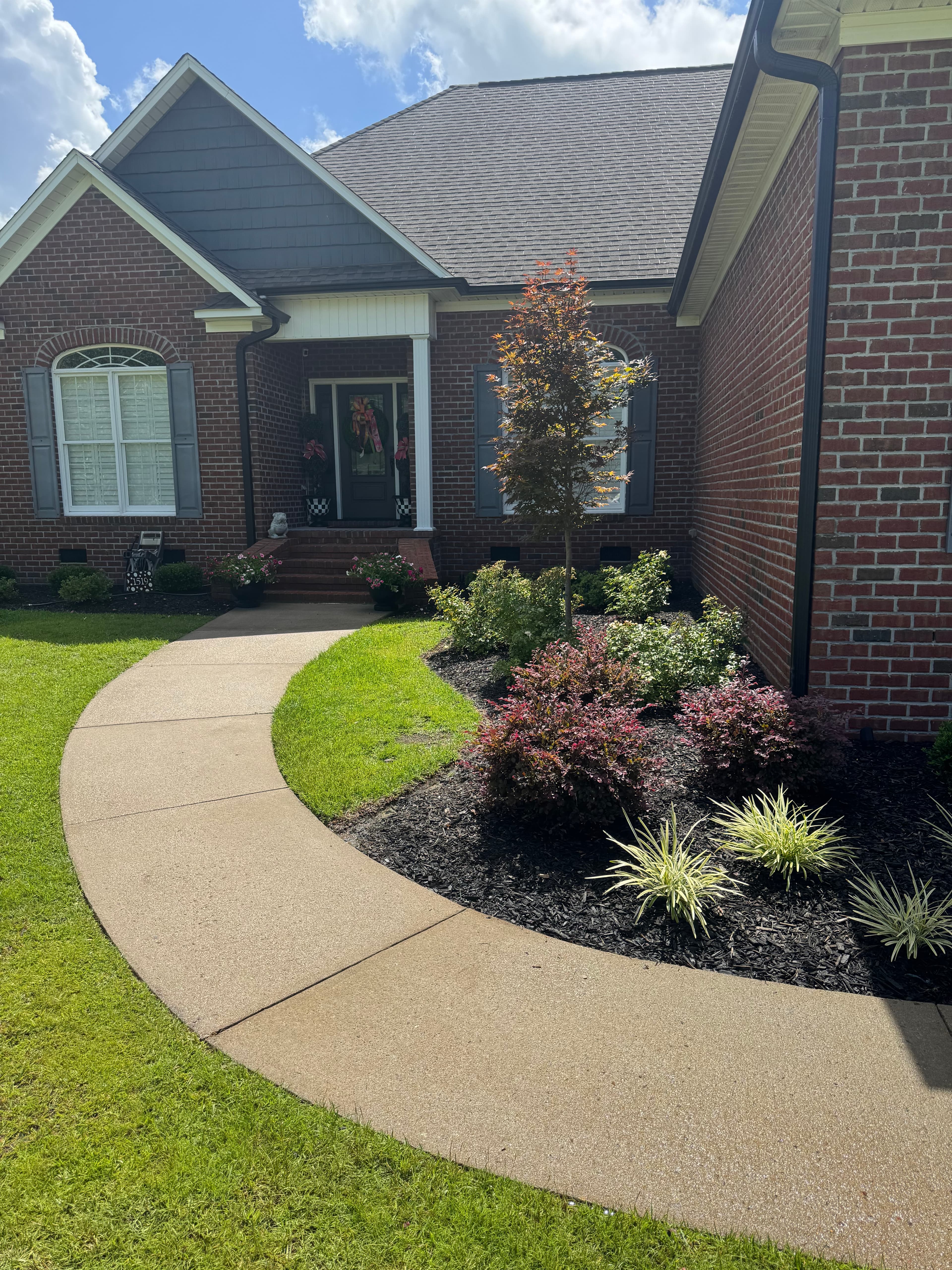 Clean concrete sidewalk after pressure washing by Max Pressure in Fayetteville NC