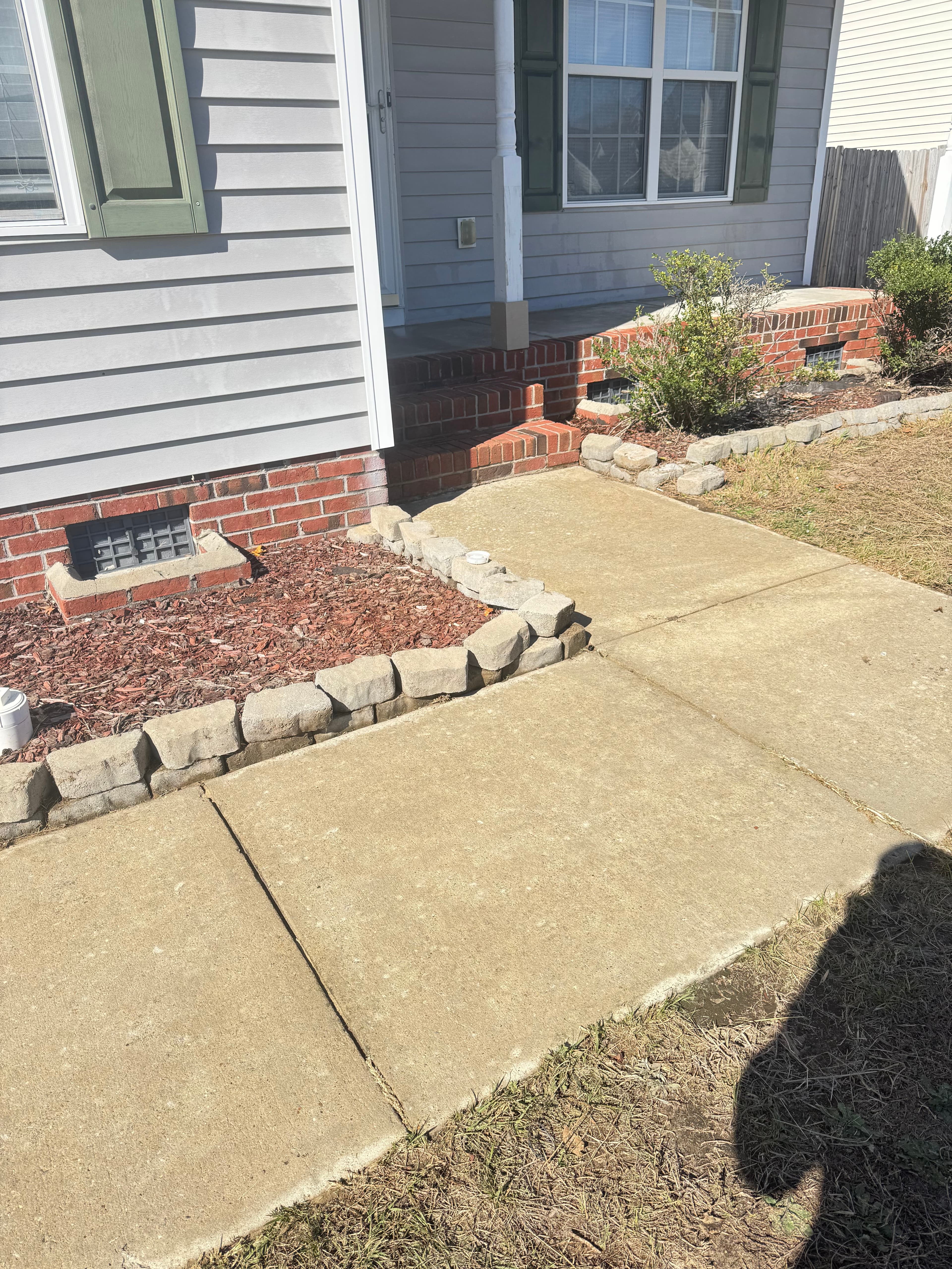 Clean concrete sidewalk after pressure washing by Max Pressure in Fayetteville NC