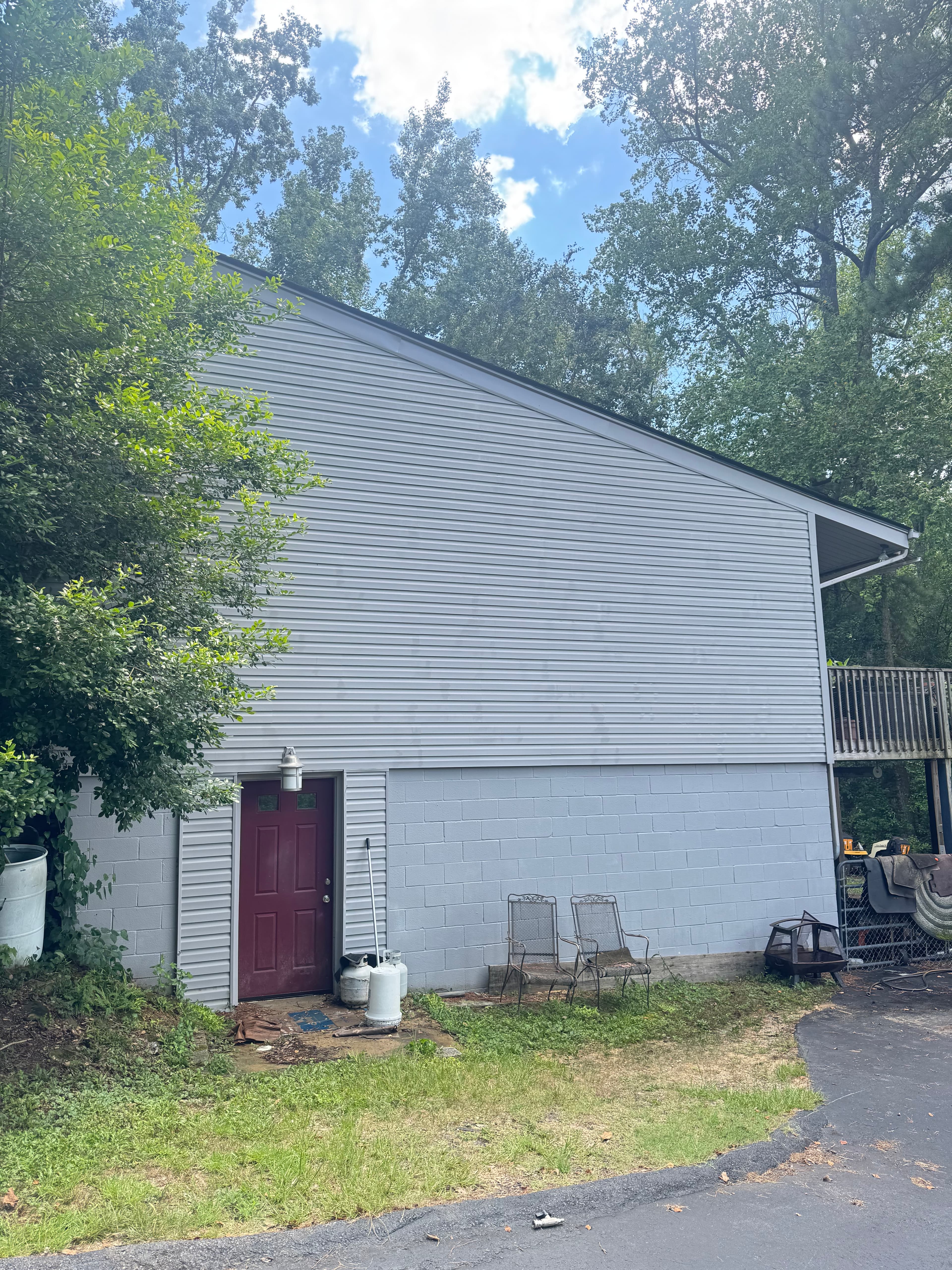 Clean home exterior with vinyl and brick siding after soft washing by Max Pressure in Fayetteville NC
