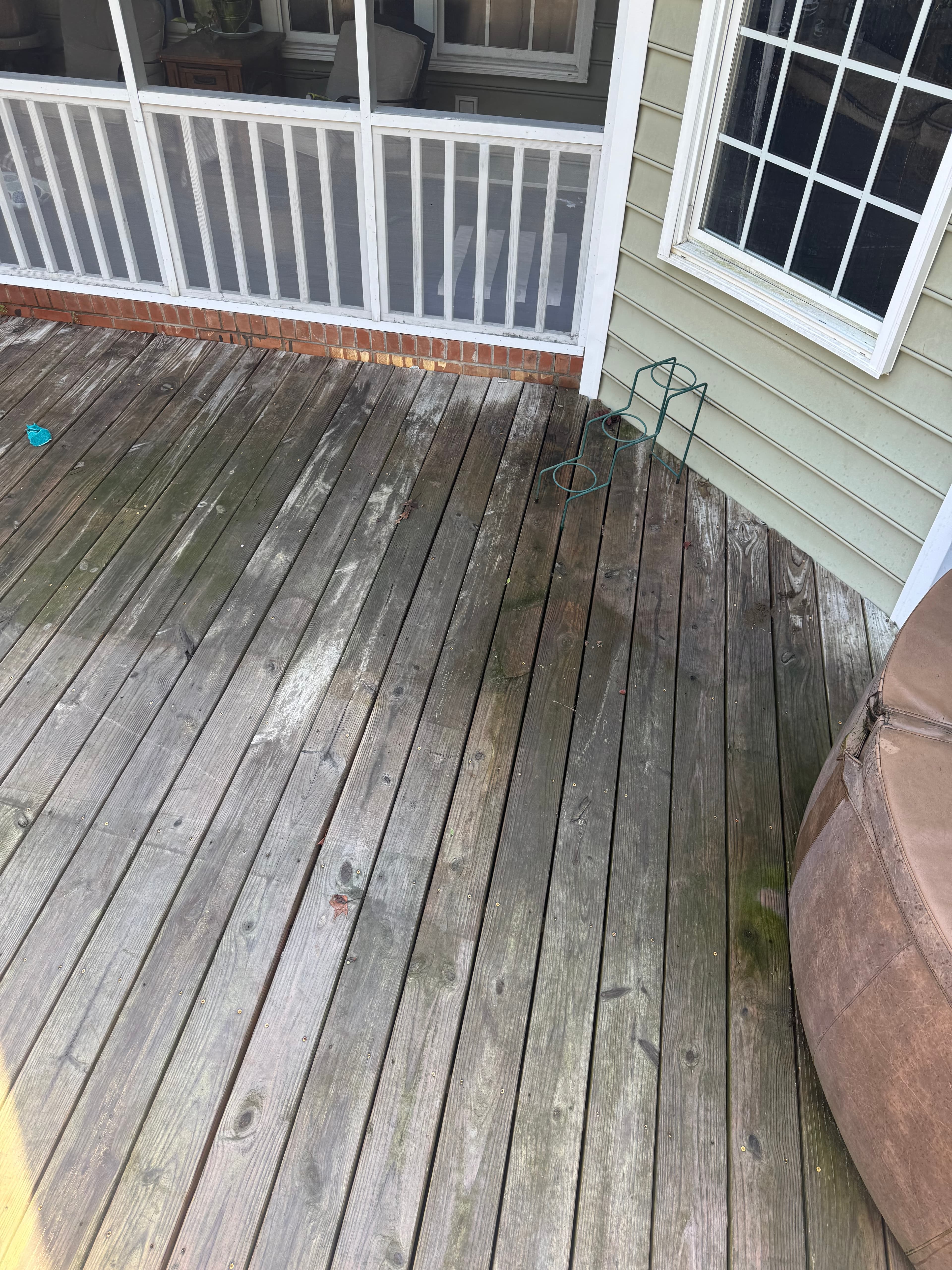 Wood deck with black mold, gray weathering, and grime in Fayetteville NC