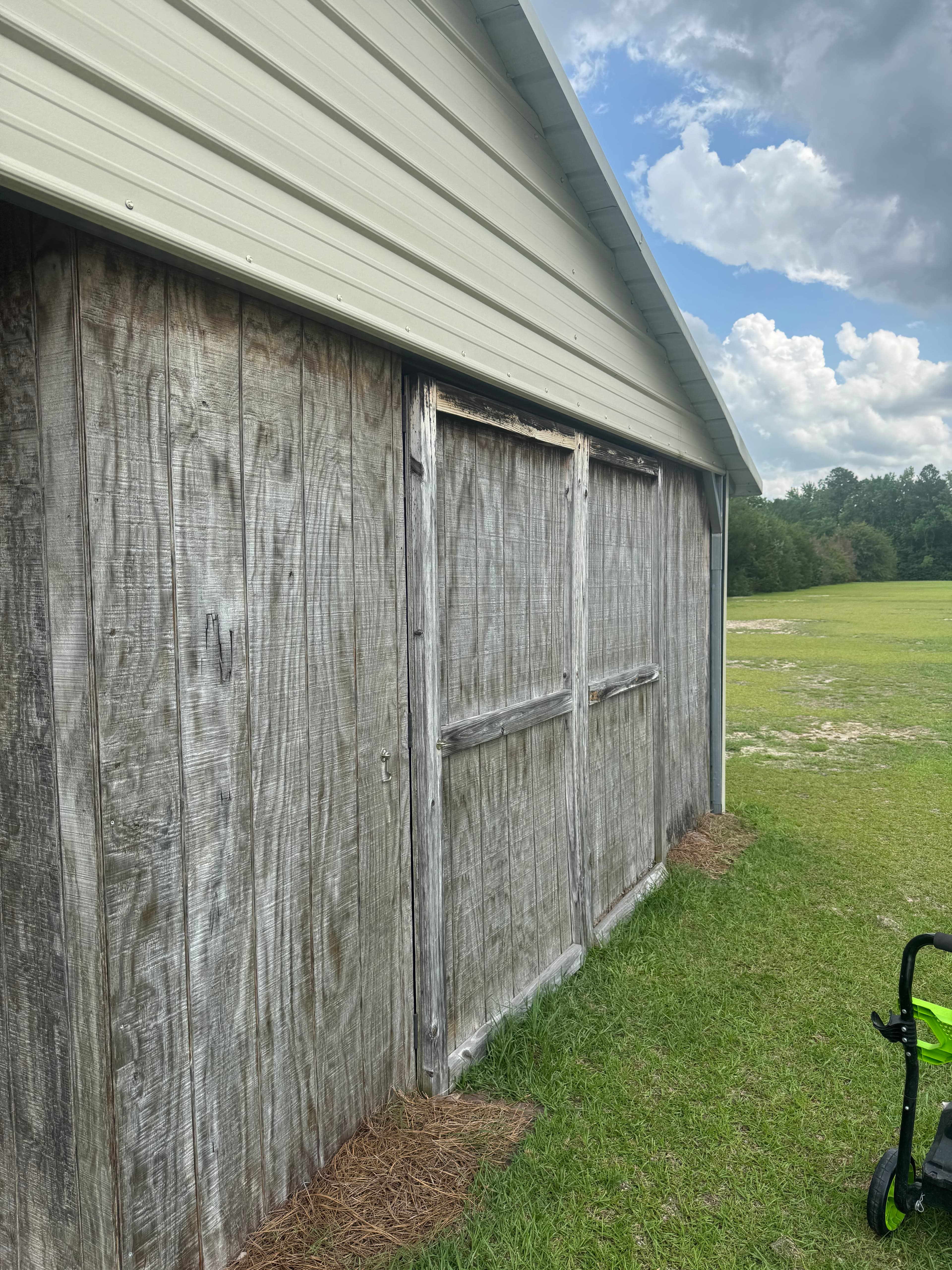 Wood shed exterior with weathering and mold in Fayetteville NC before soft washing