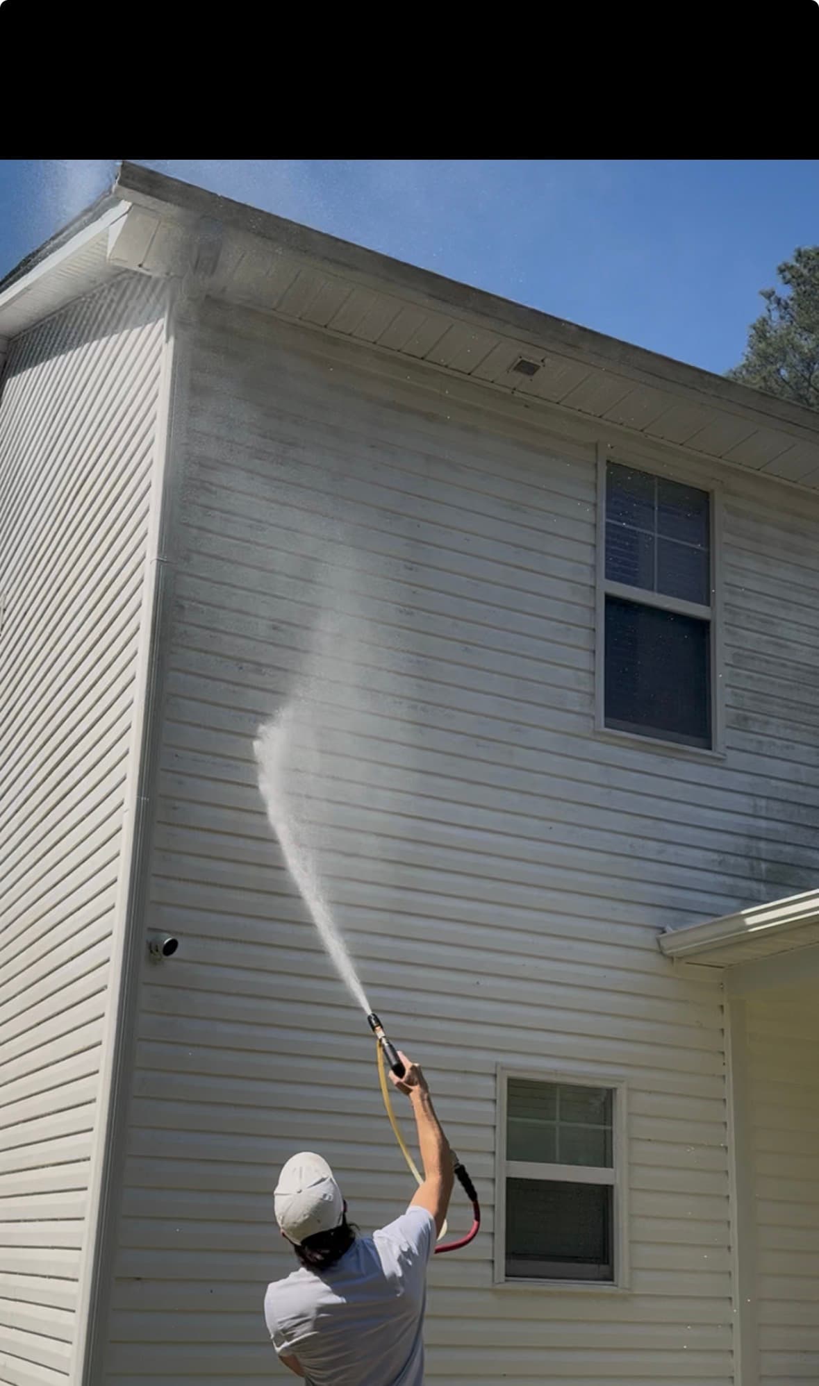 Max Pressure soft washing a home exterior in Fayetteville NC